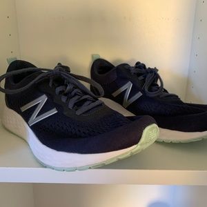 New Balance running shoes, size 10.  Only worn inside a few times.